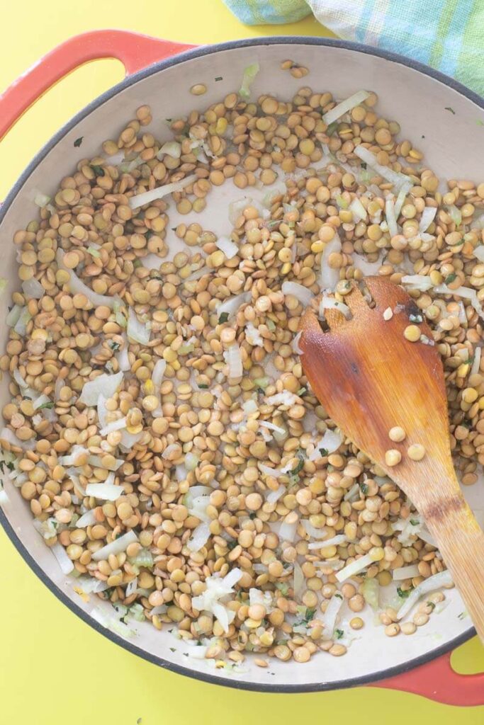 Lentil peas that have been soaked added to the sautéed herbs and spices.