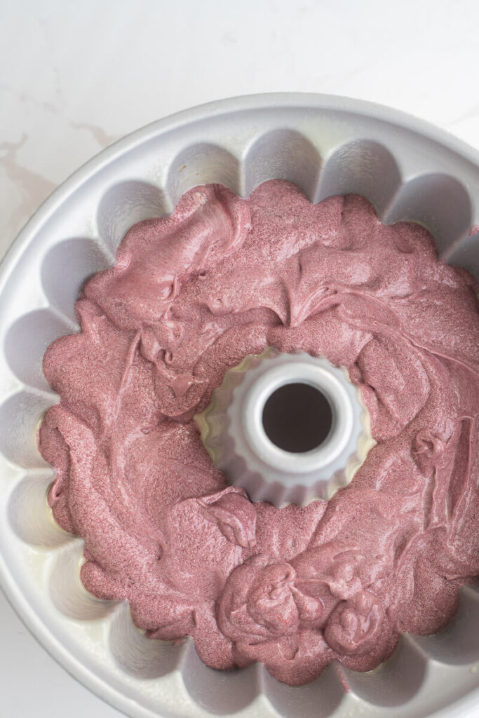 Sorrel cake batter in a greased cake pan ready to be baked.