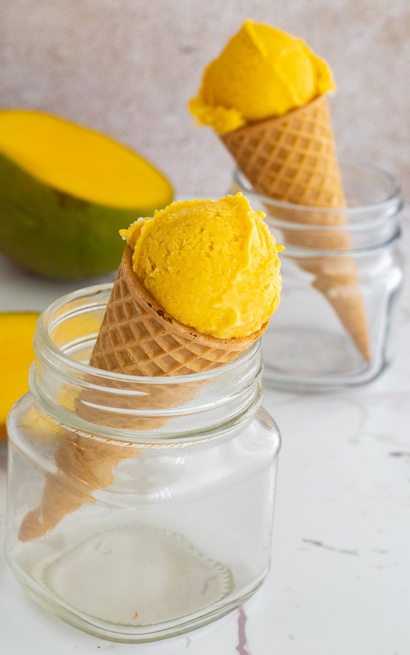 A cone of mango ice cream made at home.