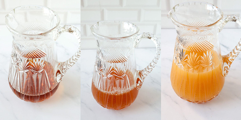 Step by step combination of the simple syrup, rum and citrus juices to make the rum punch.
