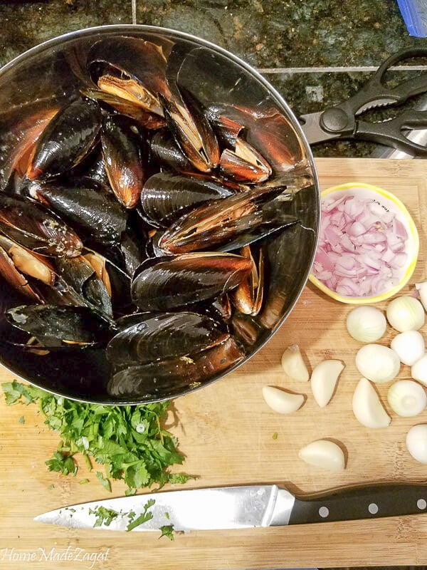 Mussels in a silver bowl with the other ingredients cleared out. 