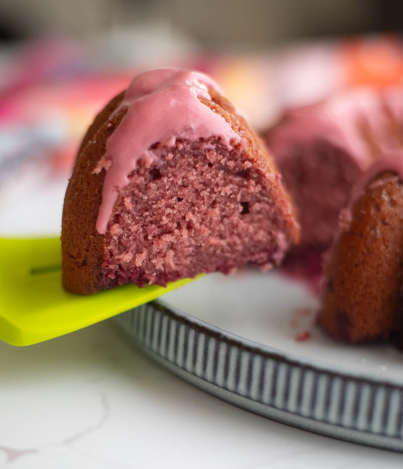 A slice of sorrel cake from the side with sorrel glaze.