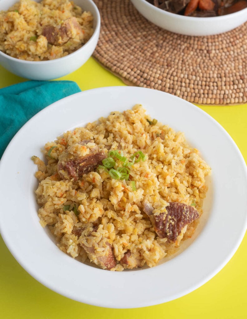 Split peas and rice cookup in a white bowl.