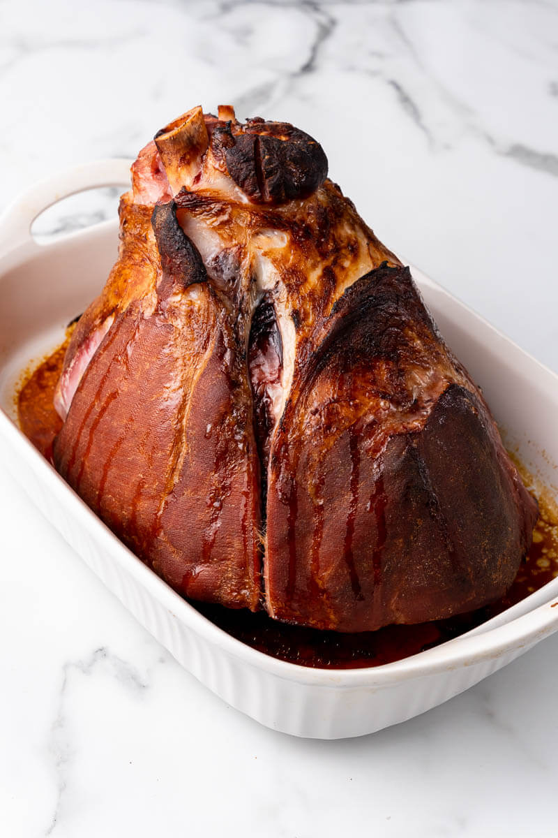 Ham, halfway baked with the skin on.