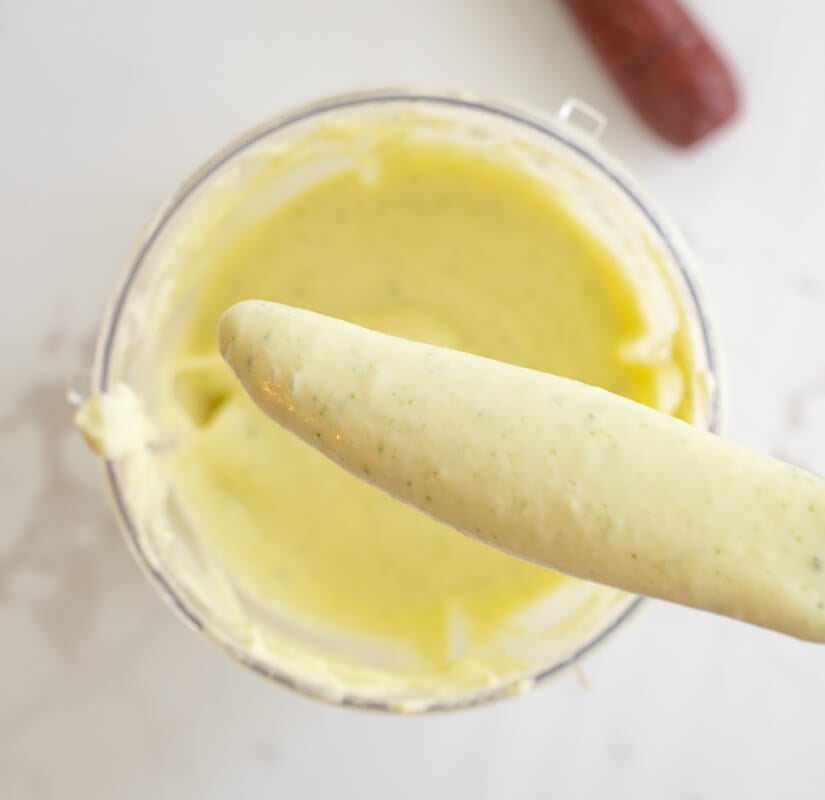 Blended Trini garlic sauce on a knife.