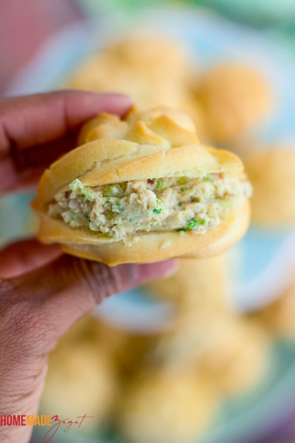 A stuffed chicken puff being held in a hand