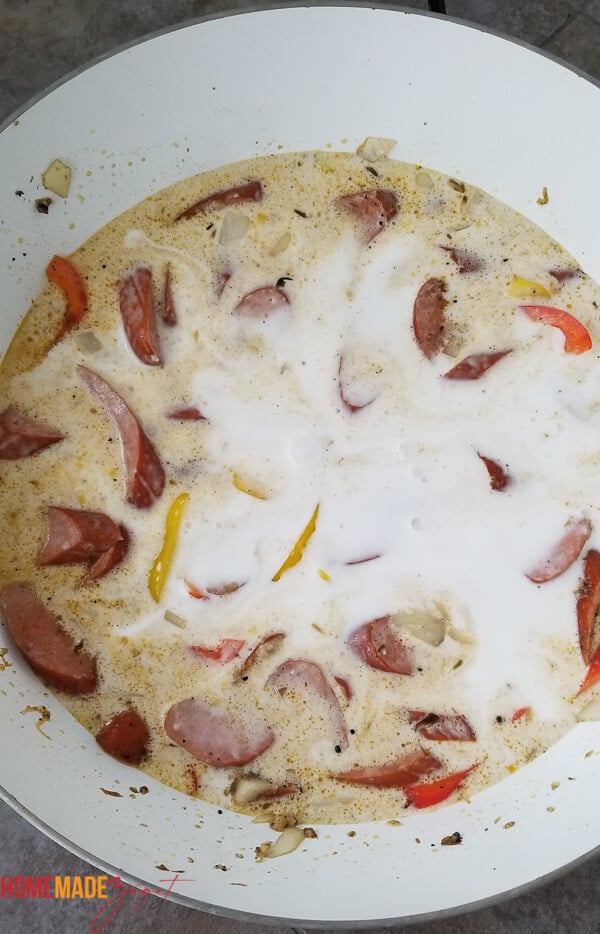 Sausage mix with coconut milk added to it to simmer down.