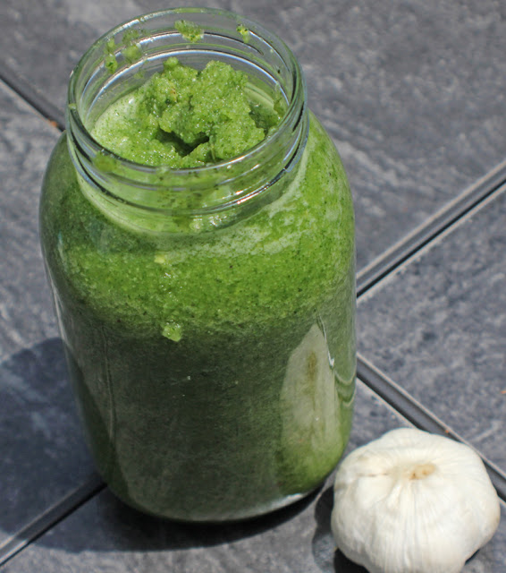 A full bottle of blended green seasoning.