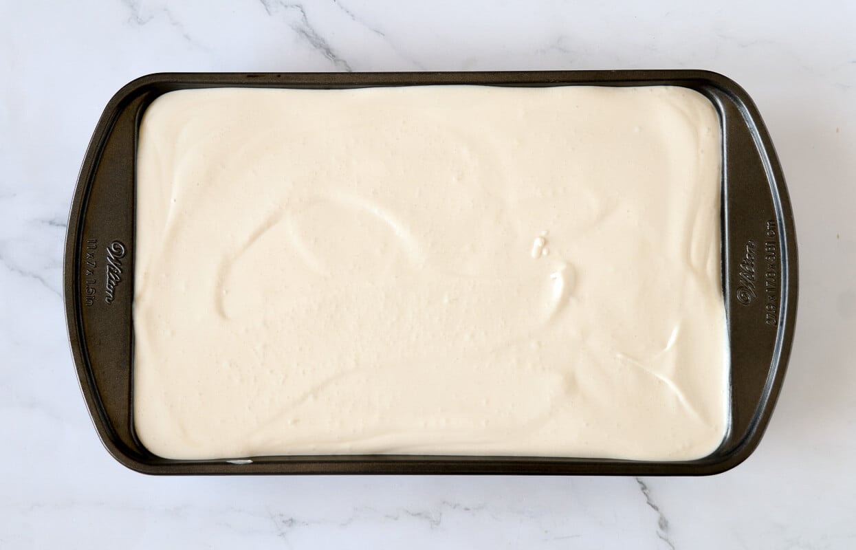 Guinness ice cream in a loaf pan before putting it into the freezer.s