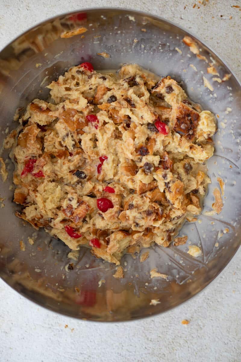 Red cherries added to bread pudding mixture with custard and raisins before baking.
