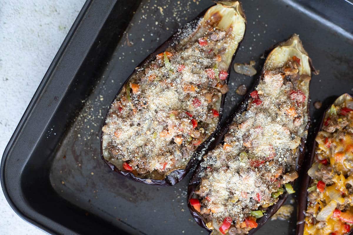Eggplants stuffed with veggie and meat covered with breadcrumbs.