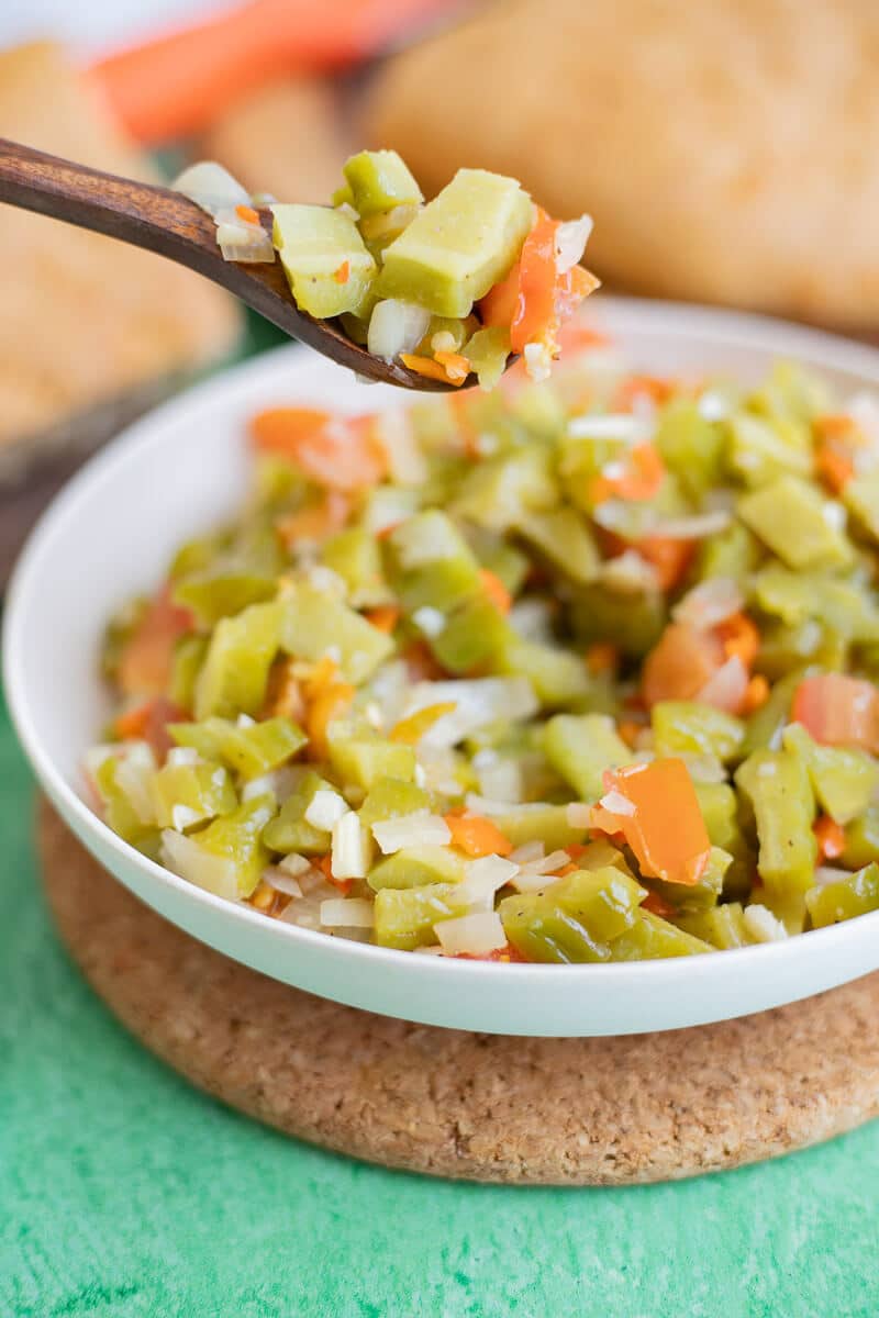 spoonful of fried caraille with chopped vegetables