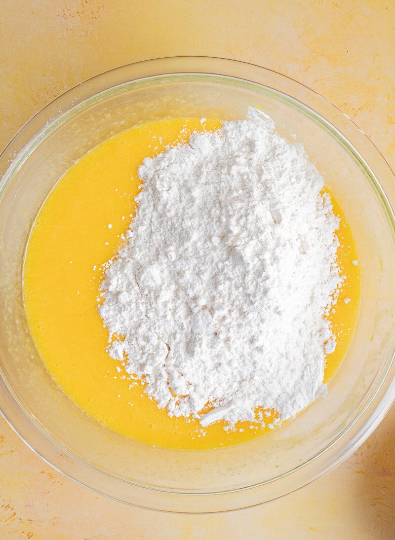 Adding flour to wet batter before mixing