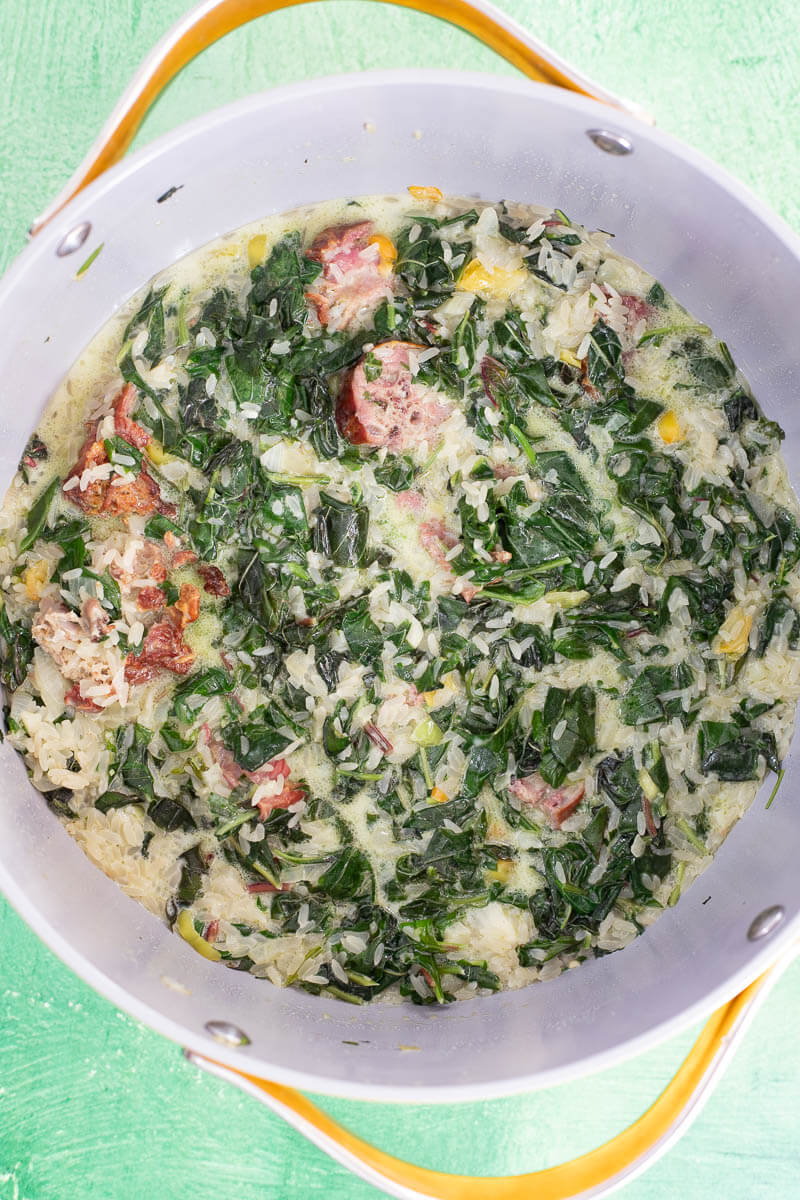 Bhaji rice cooking with coconut milk and liquid before simmering