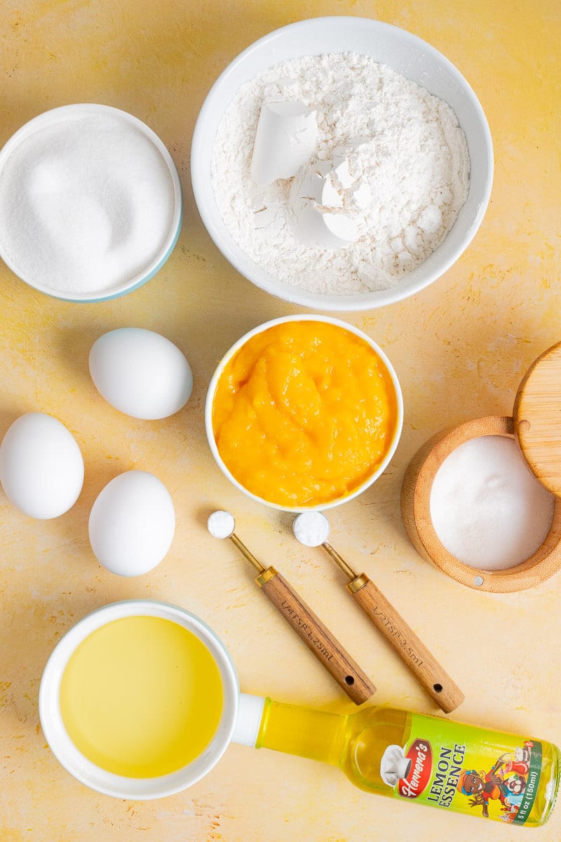Ingredients for mango bread including mango puree, flour, eggs, sugar, and oil.