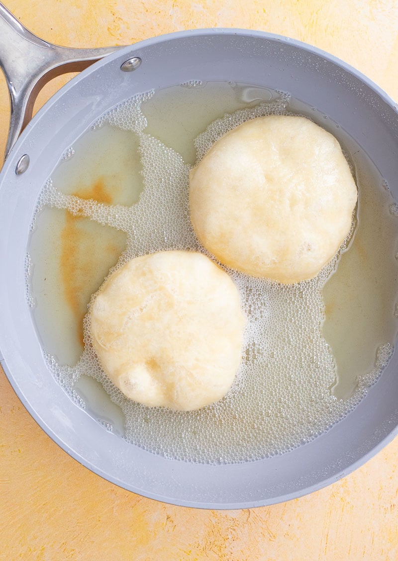 Bake frying in hot oil until golden and puffed