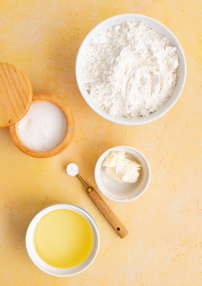 Ingredients for Caribbean fry bake including flour baking powder butter and oil