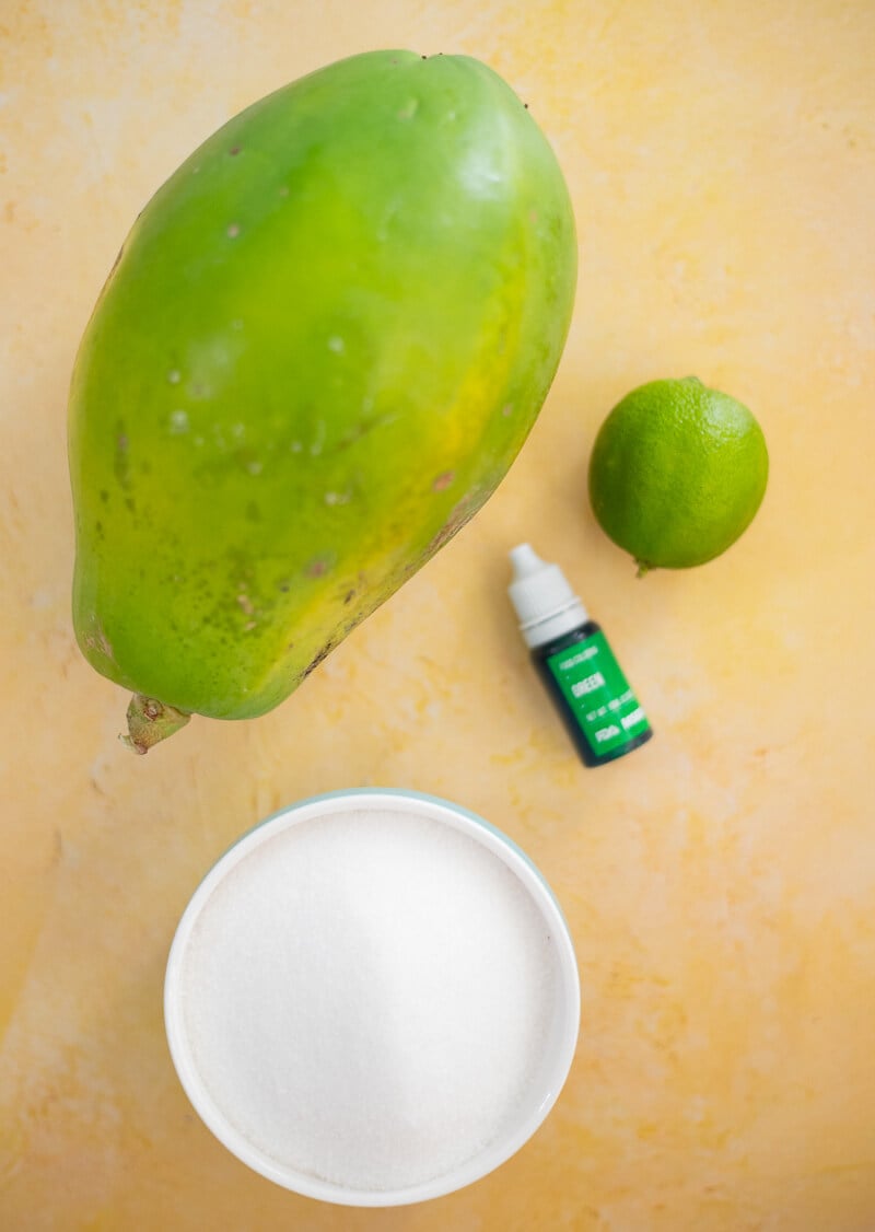 Ingredients for Trinidad paw paw balls including green paw paw, lime, sugar and food coloring.