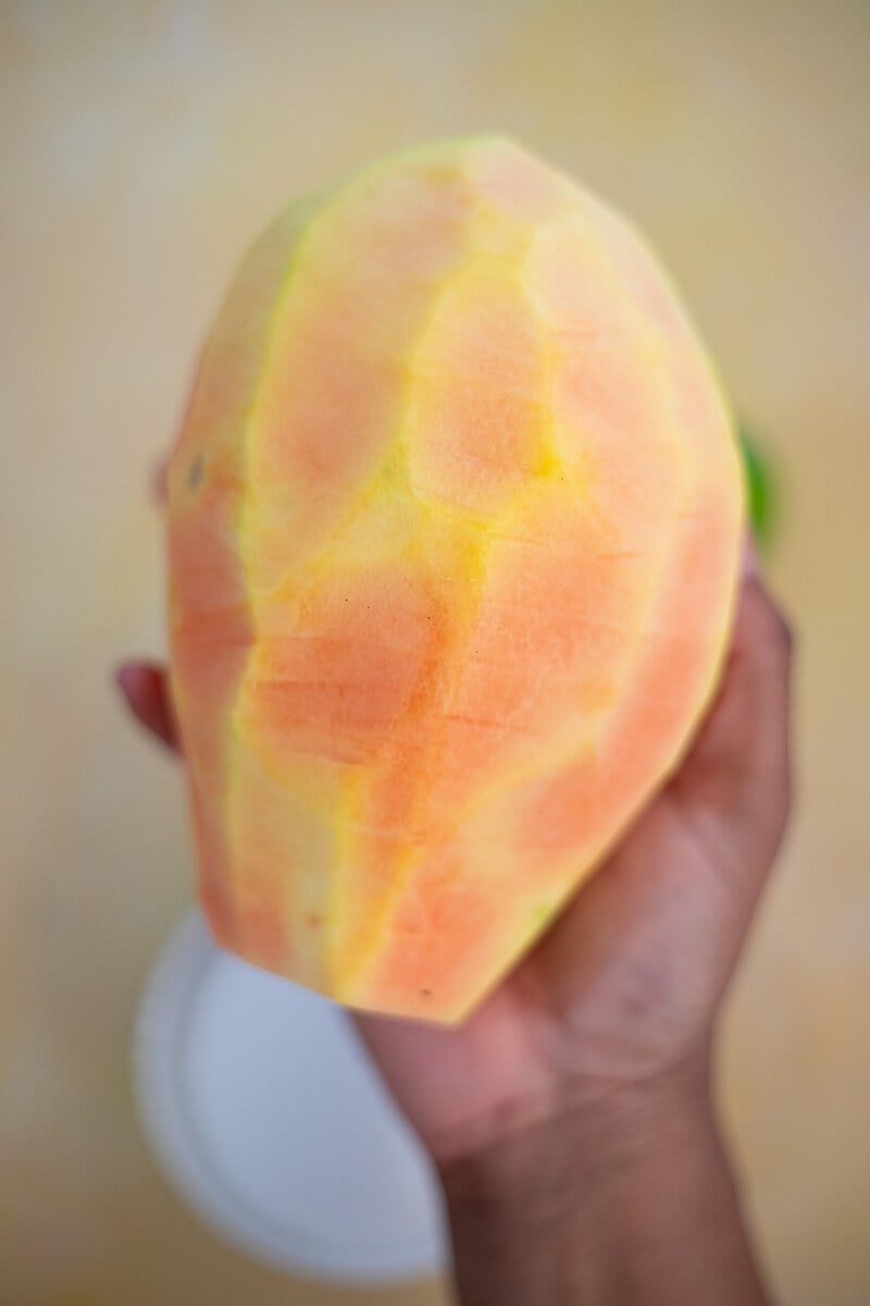 Peeled green paw paw ready for grating