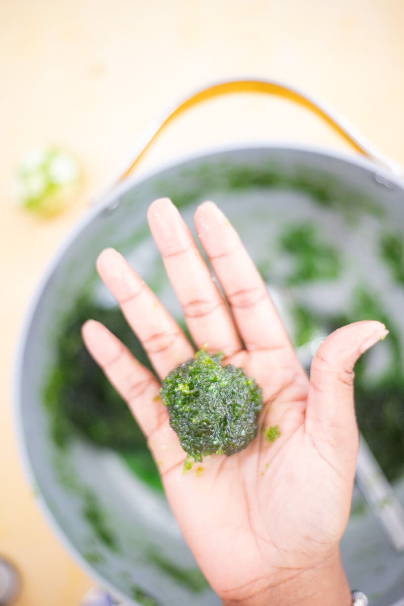 Shaping warm mixture into balls with lightly oiled hands