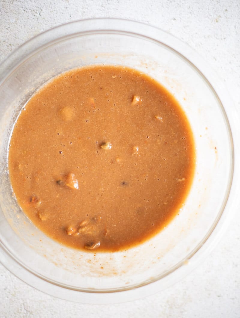 Softened tamarind pulp mashed with water before straining.