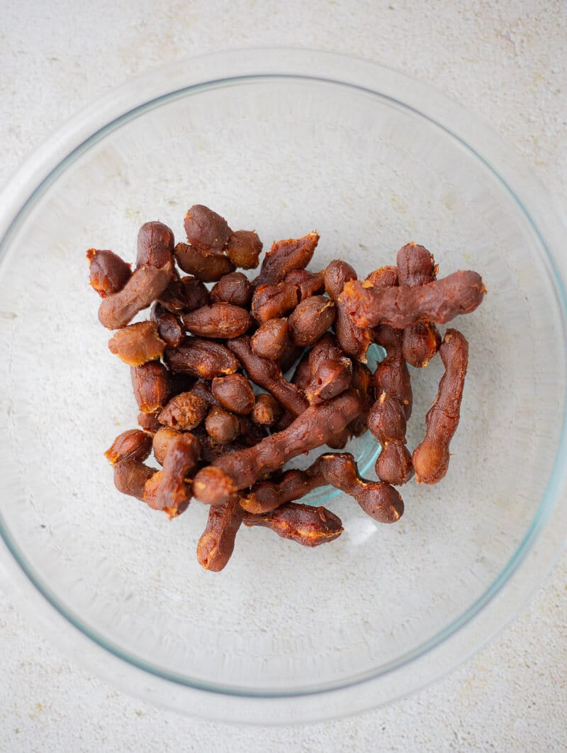 Peeled tamarind pods ready to make homemade tamarind juice.