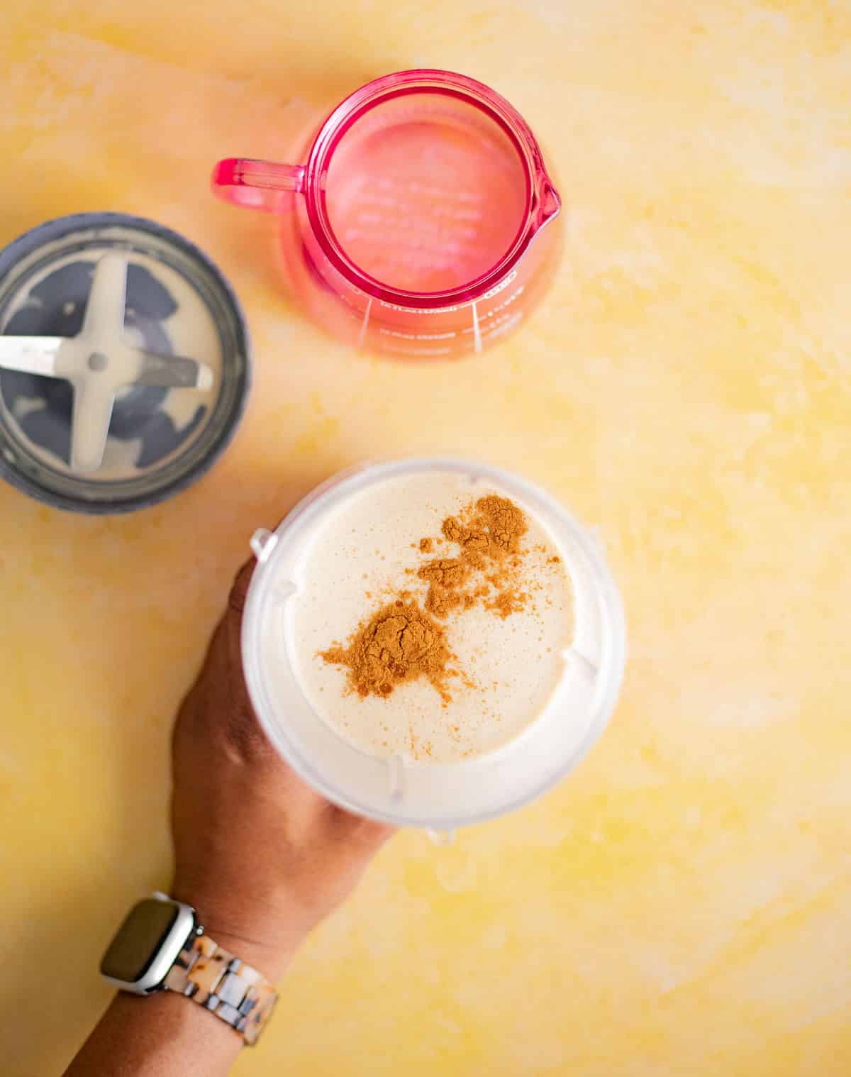 Cinnamon and nutmeg added to the blended peanut ponche de crème mixture.