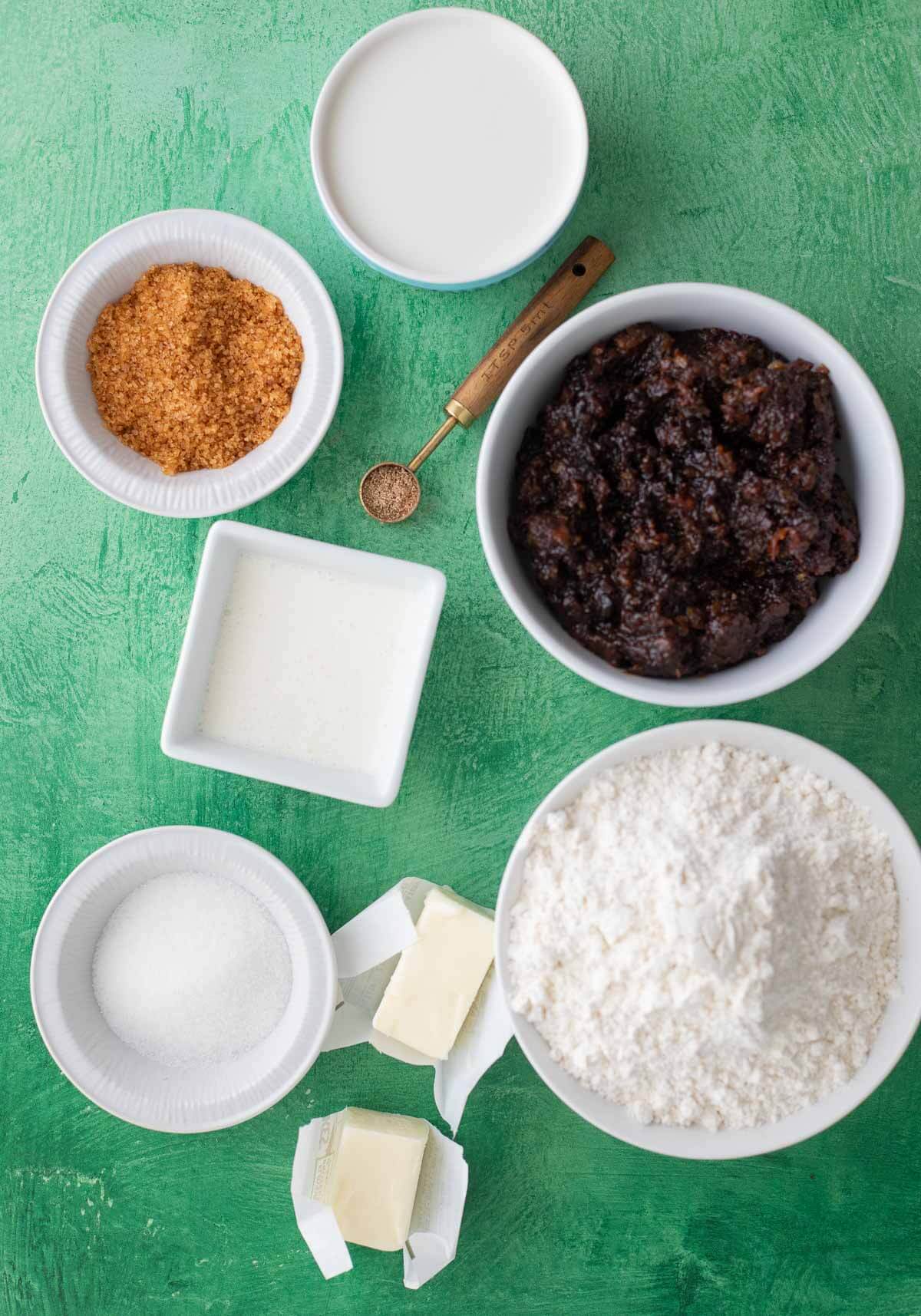 Ingredients for making black cake cinnamon rolls with soaked fruits