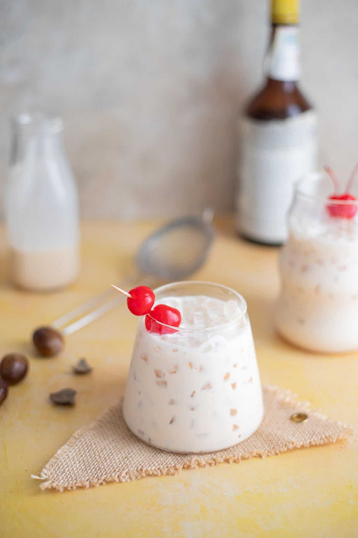Peanut ponche de crème served over ice and garnished with cherries