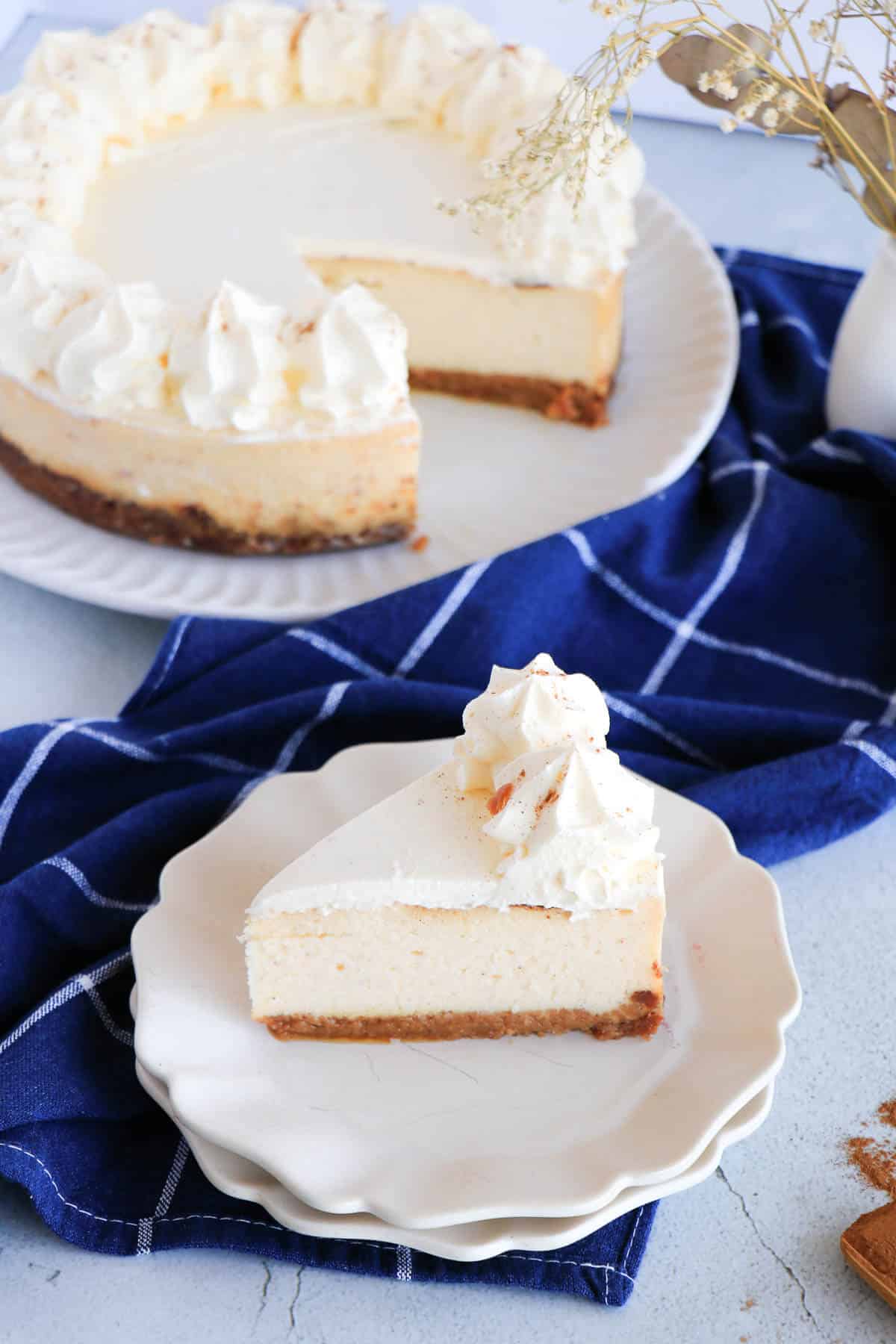 Slice of ponche de crème cheesecake with gingersnap crust
