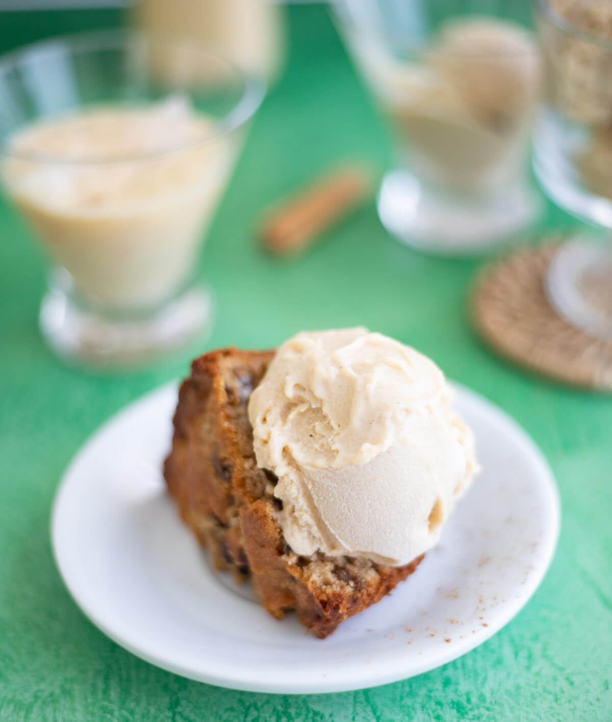 Homemade Ponche de Crème ice cream served with a slice of Caribbean fruit sponge cake.